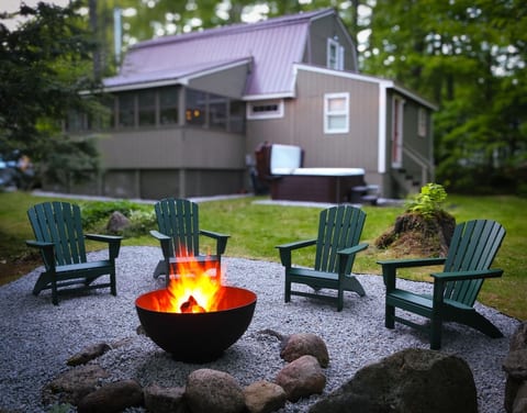 Gather around the fire, roast marshmallows, and make memories under the trees.