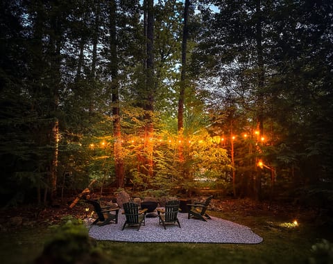 Gather around the fire, roast marshmallows, and have deep conversations under the lights and trees.