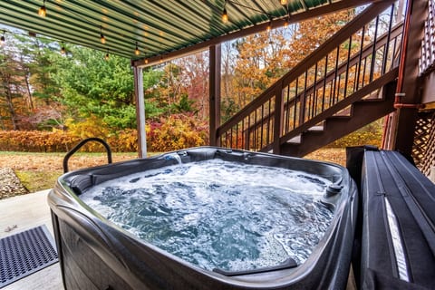 The 6-person hot tub is tucked under the upper deck and open year-round. Sheltered from rain and sun with a view of the wooded backyard.