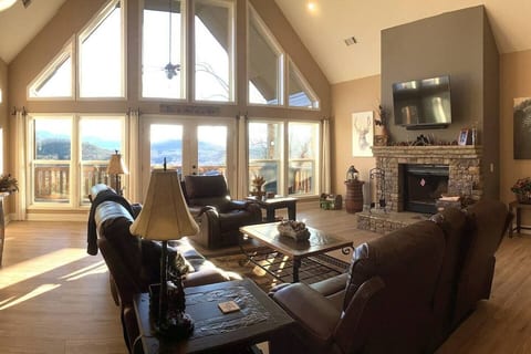 With a split plan, the large great room flows into the dining and kitchen area for family and friend interaction with plenty of seating. Panoramic view.