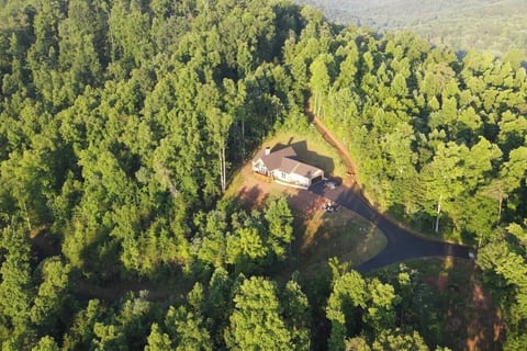 Aerial view of with paved roads on 7 1/2 private acres with anabundance if wildlife and mountain views.