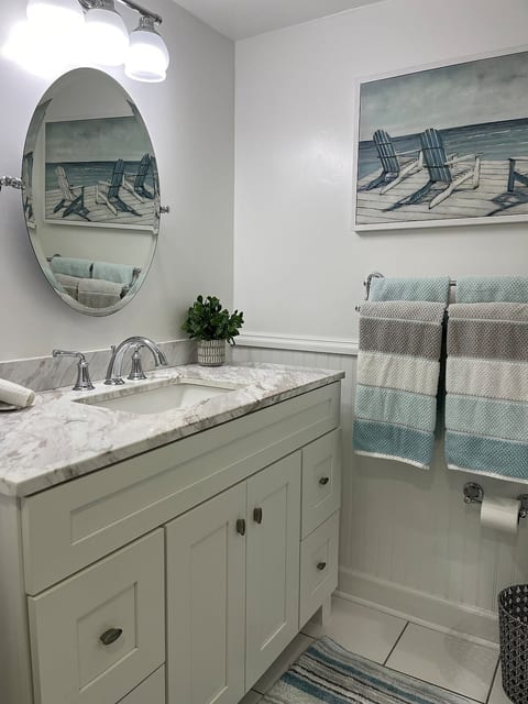 This is the updated main vanity located in the bathroom, while the extra vanity is outside the bathroom door.