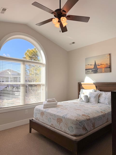 Bedroom 2 of 3 has a Queen-Sized Bed. Unpack your suitcase in the dressers to feel this is your home away from home.