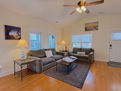 With Plenty of Natural Light & Comfortable Seating, the Living Area is Great for Gathering Together to Play Games & Watch TV.