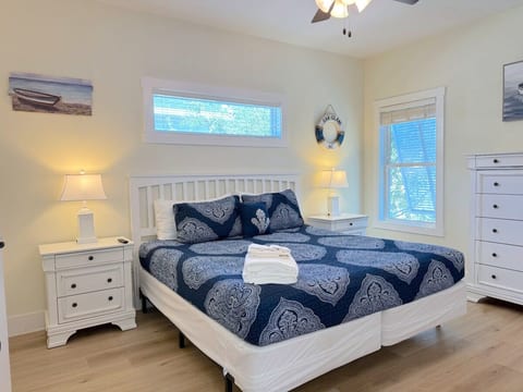 The Primary Bedroom with a King Sized Bed has an EnSuite and Walk-In Closet.