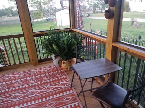 A great screen porch for relaxing and dining al fresco.