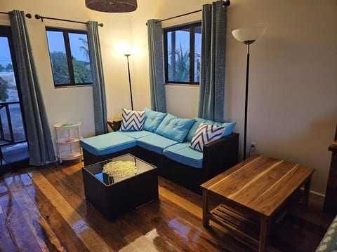 Living area with comfortable seating, and tables for work, eating, games, or a place to put your stuff.