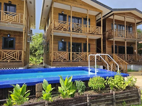 Two story building, with pool out front. Unit is on the second floor.