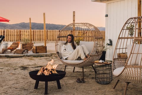 Gather around the fire, watch the stars appear, and end the day beneath the desert sky.