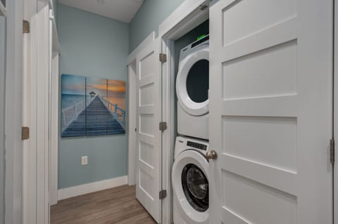 Convenient in-home laundry with a bright, coastal-inspired design