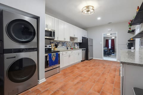Full kitchen with stainless appliances and washer/dryer