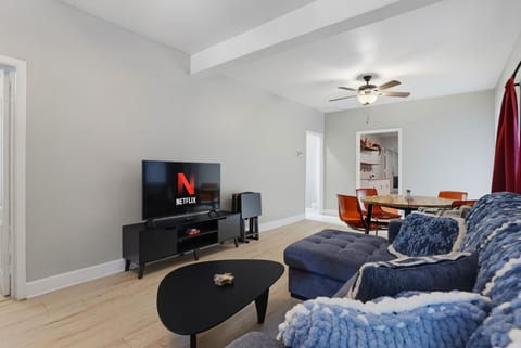 Living room with smart TV and sectional