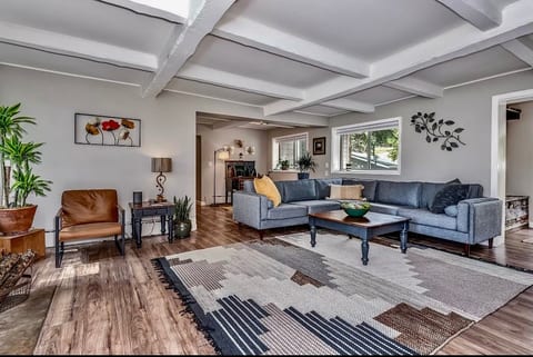 Large living area that is generous with living plants to keep the air pure and clean. You can relax on your comfortable couch, watch a movie, or play some games.