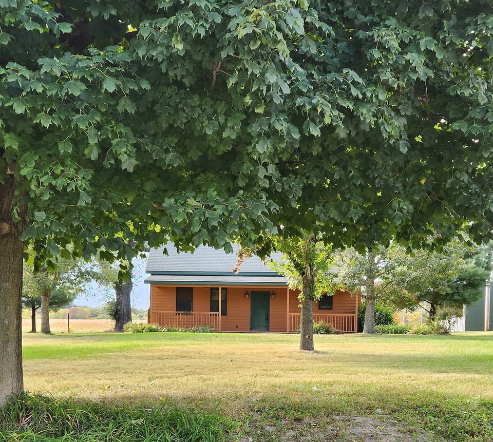 The porch is a comfortable place to relax and enjoy the view.