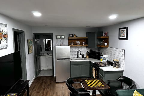 Modern kitchenette with stylish dining nook and sleek finishes