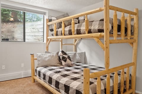 Our Bunkroom features a custom wood Twin over Queen bed. Perfect for kids or extra adults! The Jack and Jill Bathroom is attached to the Bunkroom.