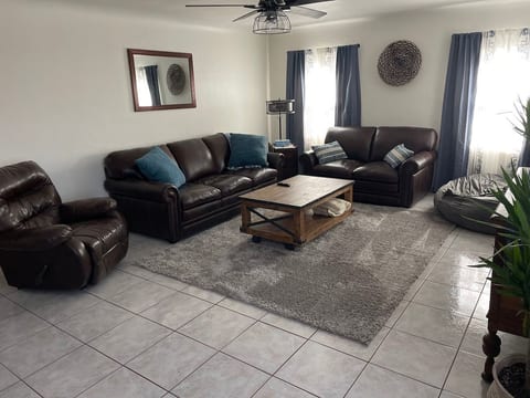Large living room with plenty of room for a Queen air mattress. There is also (2) 5’ memory foam beam bags.