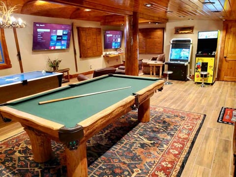 Custom Log Pool Table, Arcade Games, Gaming Nook, Air Hockey, Board Games, Small Foosball/ Coffee Table, & THREE TV’s!