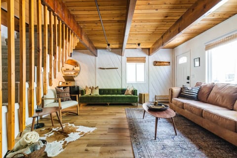 Enjoy a movie, the wood burning fireplace or play family board games in the cabin’s cozy living room.
