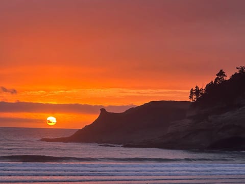 Watch the sunset from the top of the dune ramp.