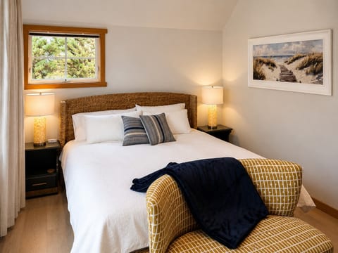 Wake up surrounded by coastal pines in the peaceful king bedroom.