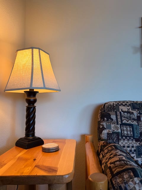 Cozy reading nook with warm lighting and rustic wood accents