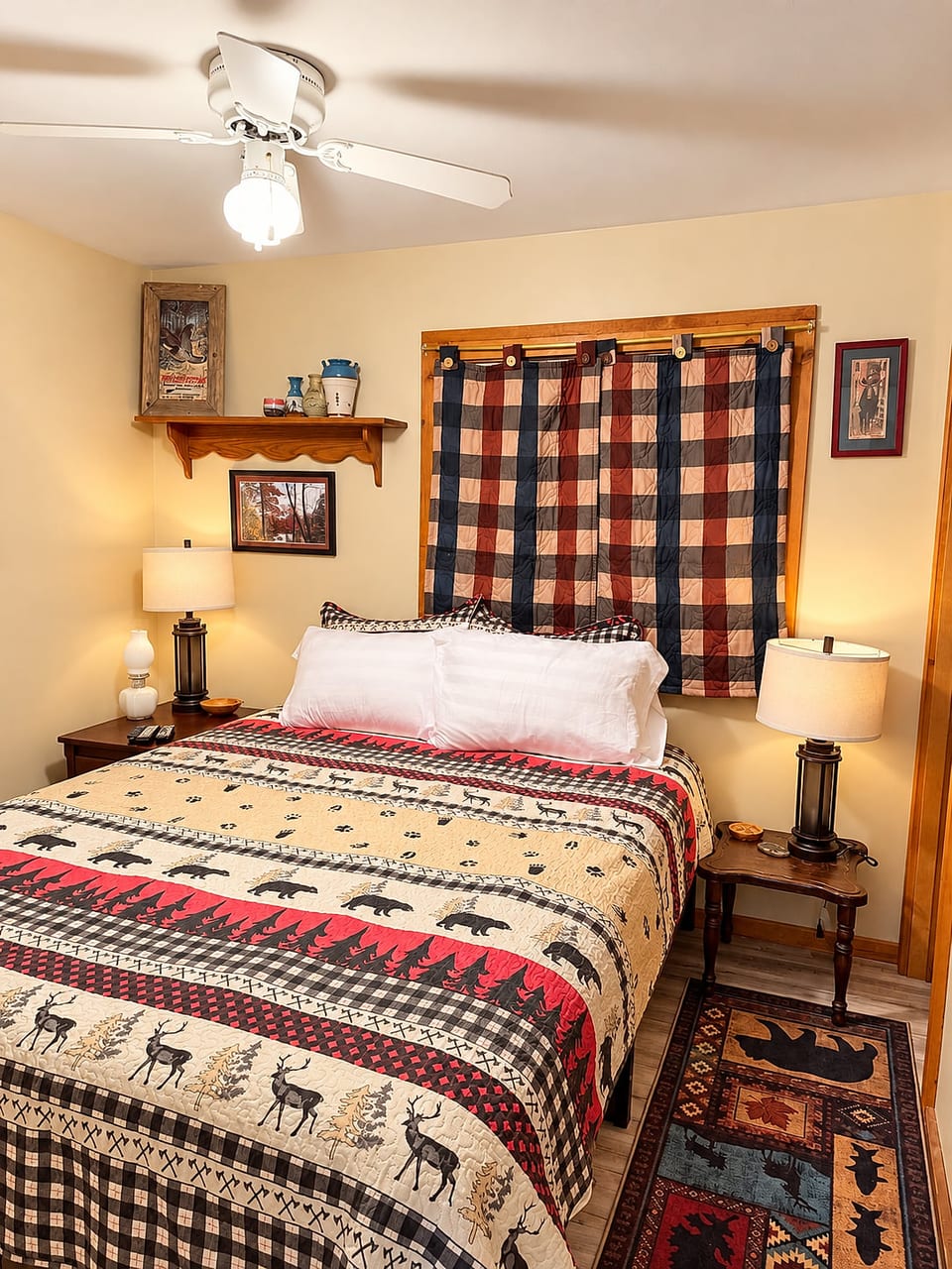 Cozy rustic bedroom with lodge decor, warm lighting, and cabin charm