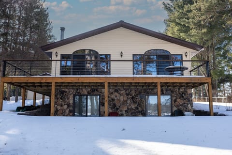 Cozy woodland cabin with large deck, scenic views, and rustic charm