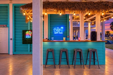 Tropical tiki bar with neon lights and breezy island vibes