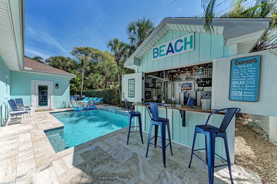 Beautiful backyard with pool and tiki bar