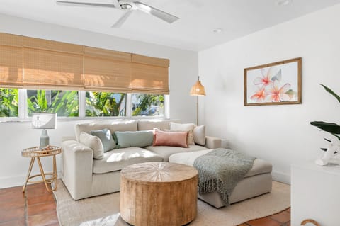 Sunlit living room with cozy sectional