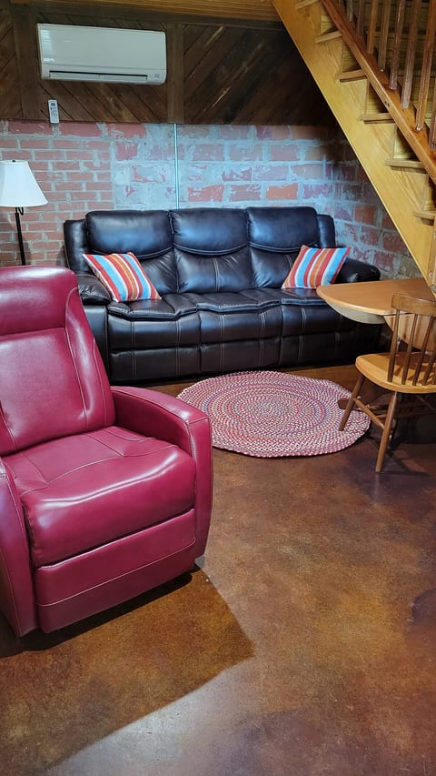 Sitting area is located downstairs and there is a Roku TV to enjoy.