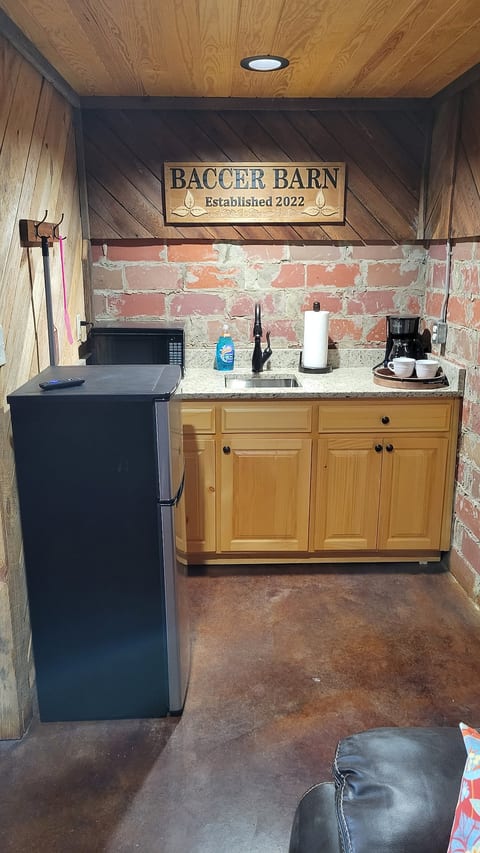 Kitchenette, complete with a mini refrigerator, microwave, and coffee maker.