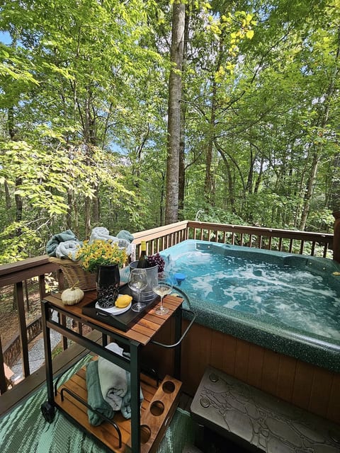 Unwind in your private hot tub surrounded by the forest—sip wine, soak under the stars, and let nature’s serenity melt your cares away.