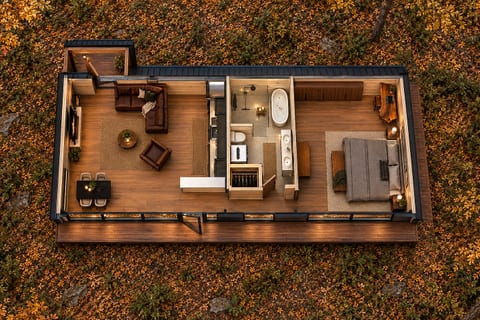 Modern forest cabin with cozy interiors and stunning autumn surrounds