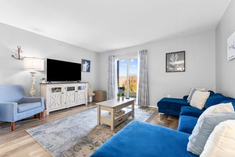 Room on the couches for both families after a day at the park, with a Roku TV for movie night.