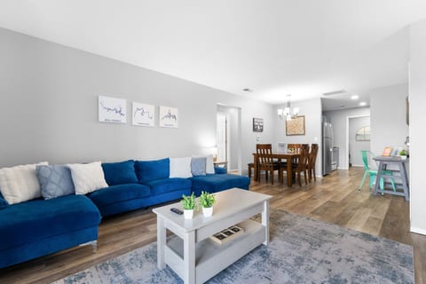 Two living rooms, one in each condo, so the grown-ups and the kids each get their own space for movie night.