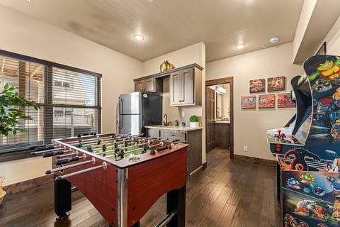Downstairs game room: pool table, ping pong, foosball and arcade games. The kids’ headquarters, rain or shine.