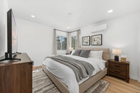 Primary Bedroom with king bed, 55" Smart TV, mini-split for AC/Heating. Large closet and drawers for all your clothes.