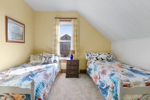 This country Cow themed room is great for the kids or just the young at heart , 2 Twin beds  sit side by side with comfortable sleeping arrangements for all . The window in this room as spectacular views of the sunset and the barn yard. 