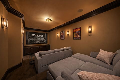 A private theater experience with a 98-inch screen, immersive surround sound, and plush loungers that convert into queen sleeper sofas for the ultimate movie night.