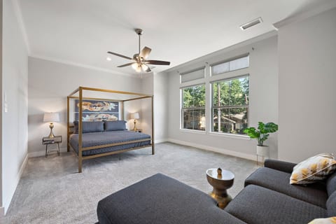 Giant master bedroom, flat screen TV and sectional for lounging.