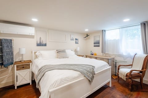 Comfy King sized bed; dresser; leather chair; laptop table; large closest; two nightstands; touch bedside lights with incorporated charging pots for both USB A and USB C