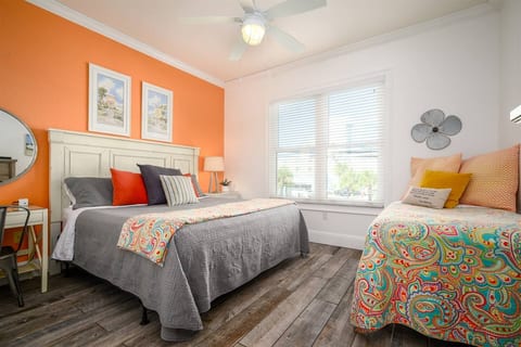 KING + TWIN bedroom with a dedicated workspace—flexible sleeping for families plus room to work.
