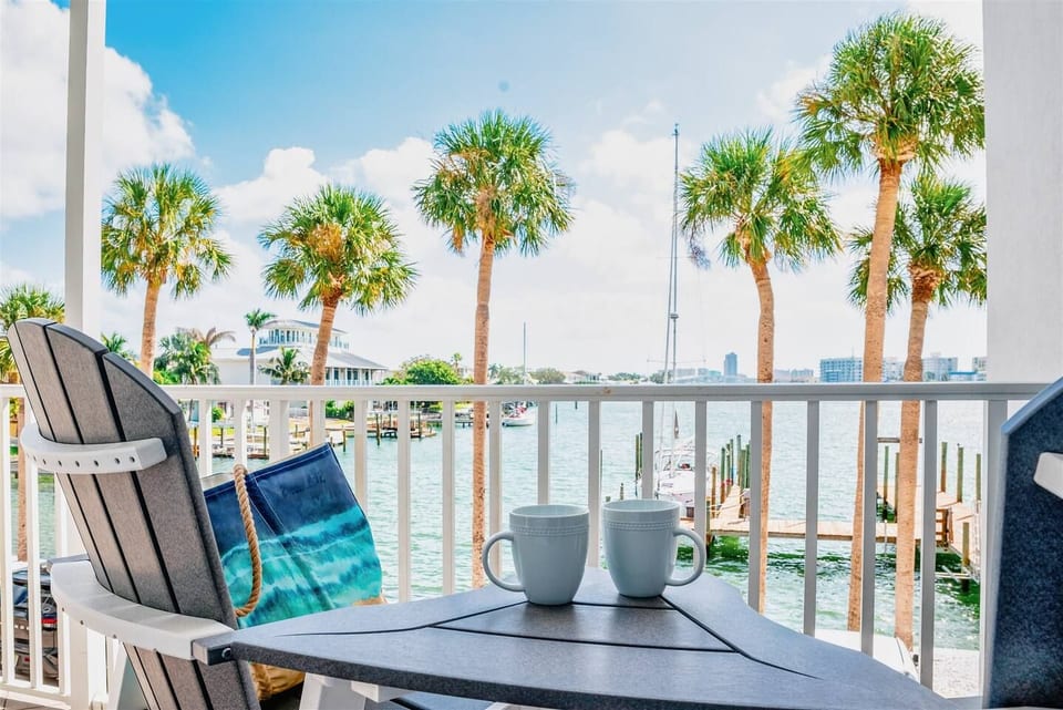 Start your morning with coffee on your private balcony overlooking the peaceful harbor.