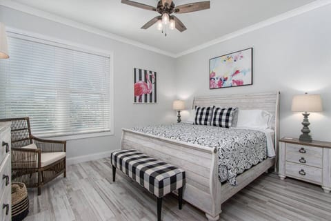 Private KING bedroom with TV, ceiling fan, charging stations and plenty of storage.