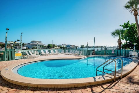 Enjoy the heated bayfront swimming pool and sundeck—perfect for swimming, lounging, and relaxing with beautiful harbor views.