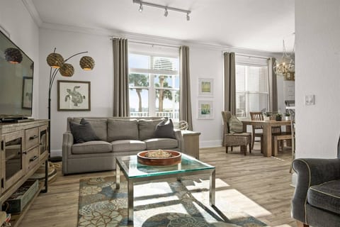 Condo #1 – Dock of the Bay: Spacious waterfront living room with sleeper sofa, Roku TV and Cable.