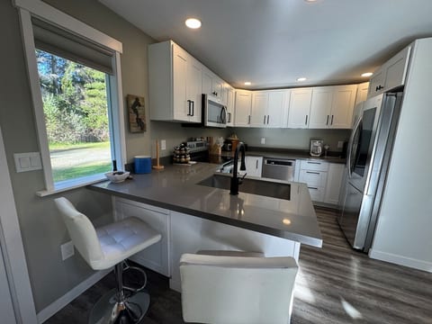 A very nice, large kitchen with counter bar seating