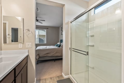 Bright en suite bath with spacious glass walk-in shower